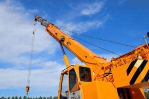 Orange crane against blue sky