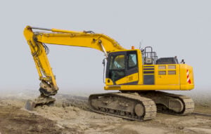 Yellow Crawler Excavator in fog
